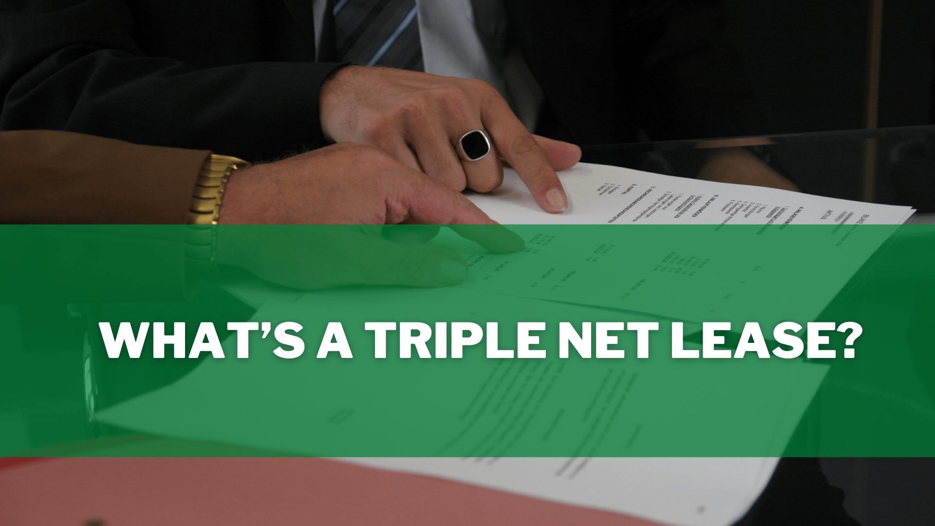 Two people looking over a triple net lease.