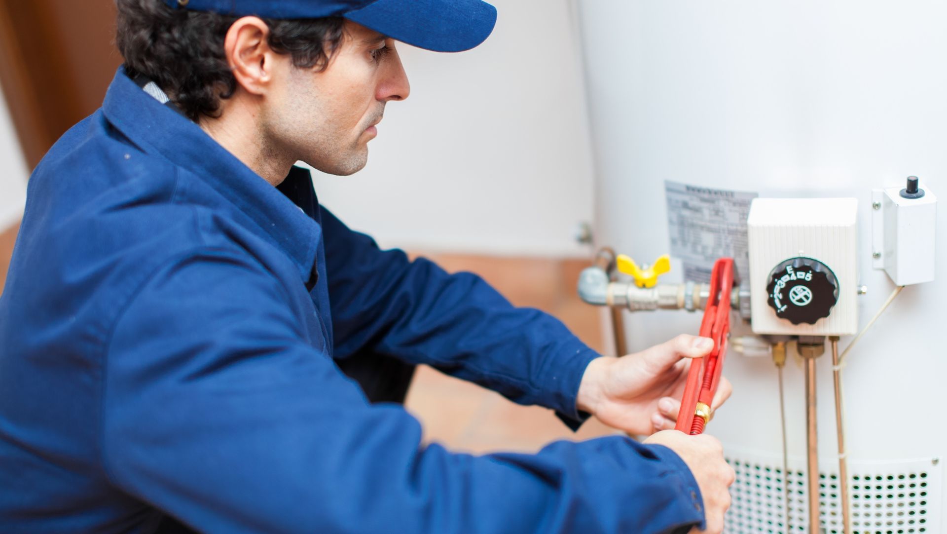 Redding rental property emergency maintenance repair technician fixing an electrical wall heater