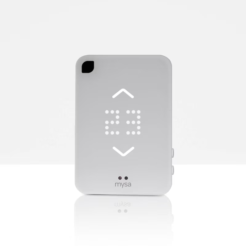 White Mysa smart thermostat displaying 23 degrees with up and down arrow buttons.