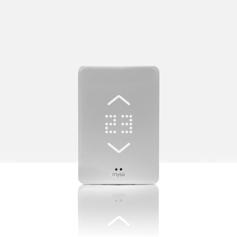 White smart thermostat with a digital display showing the temperature, up and down arrows.