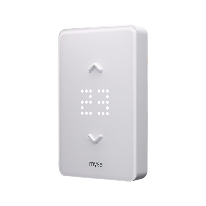 White thermostat with digital display showing