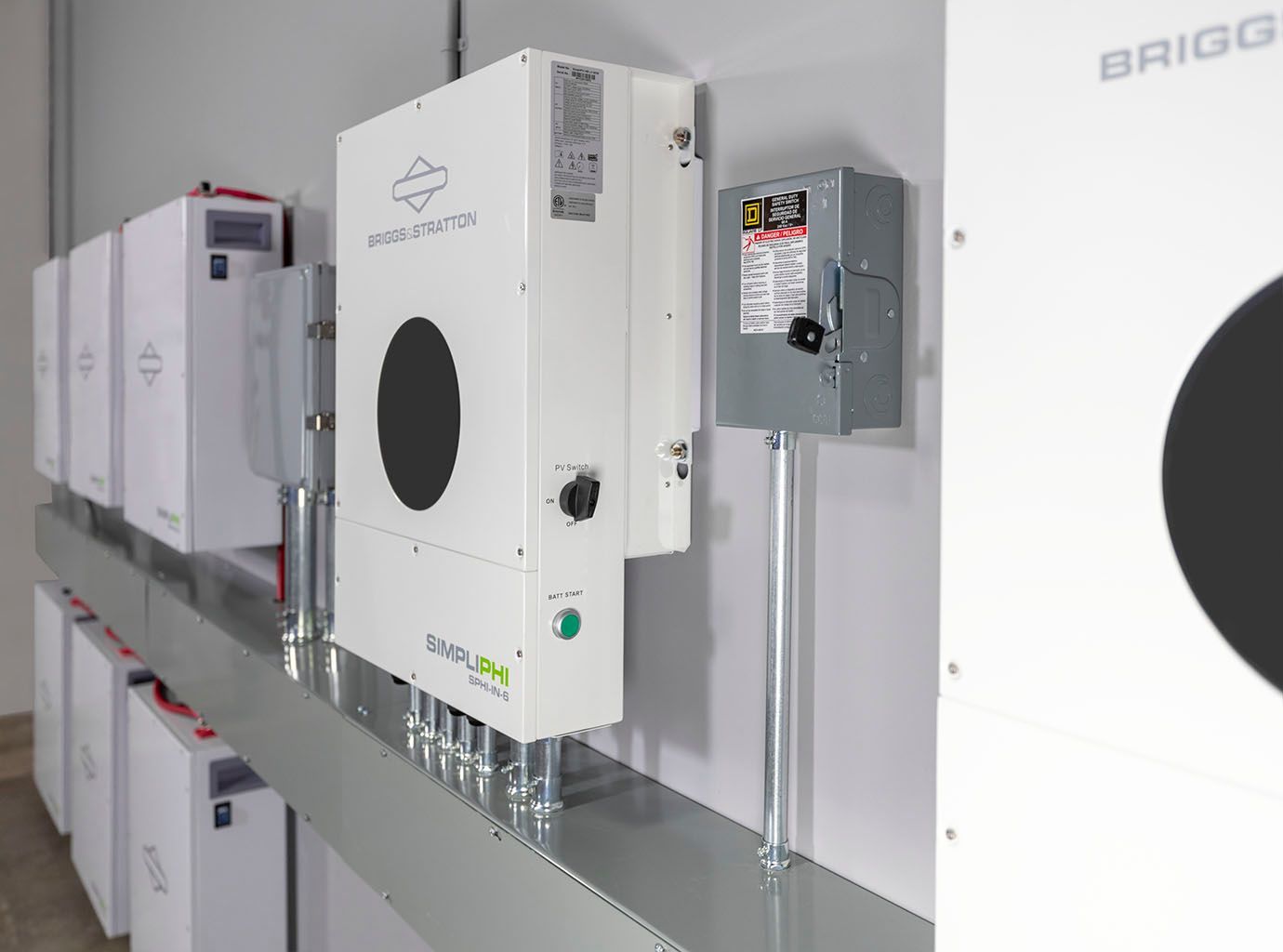 White Briggs & Stratton SIMPLIPHI solar inverter with a circular display.