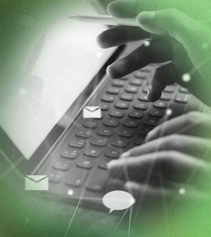 Hands typing on a laptop with digital email icons overlaid.