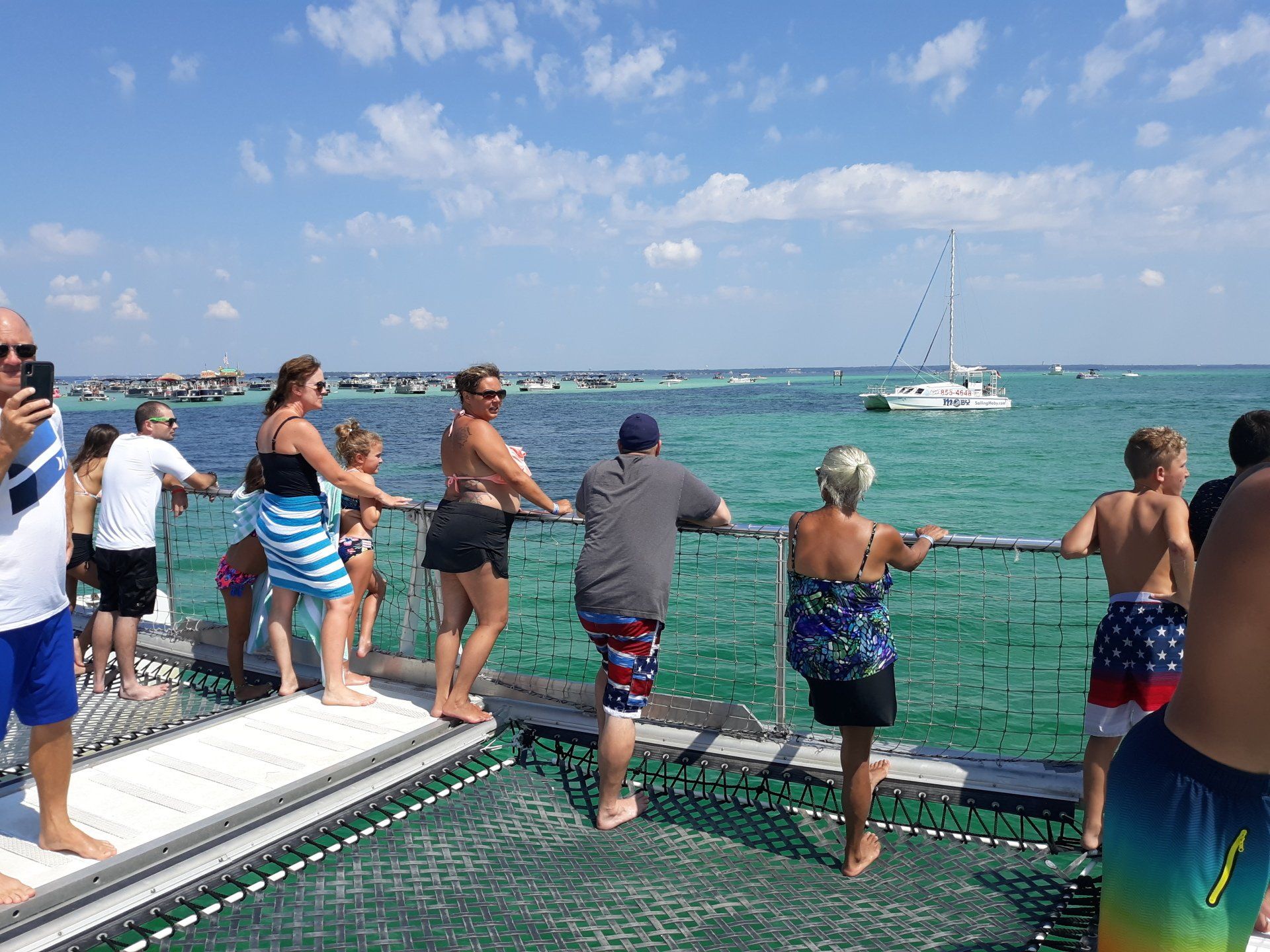 People enjoying watching dolphins on Cattywampus dolphin tours