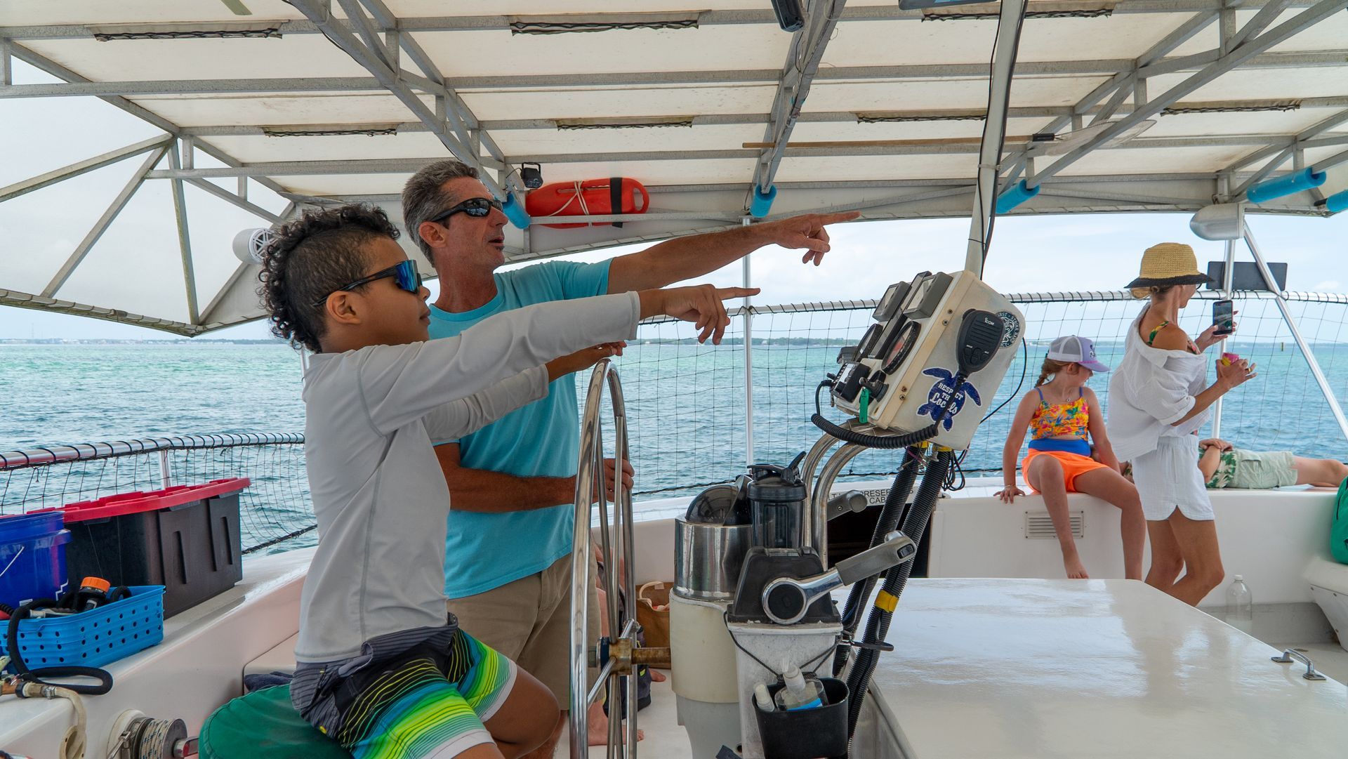Kids being captain on Dolphin tour