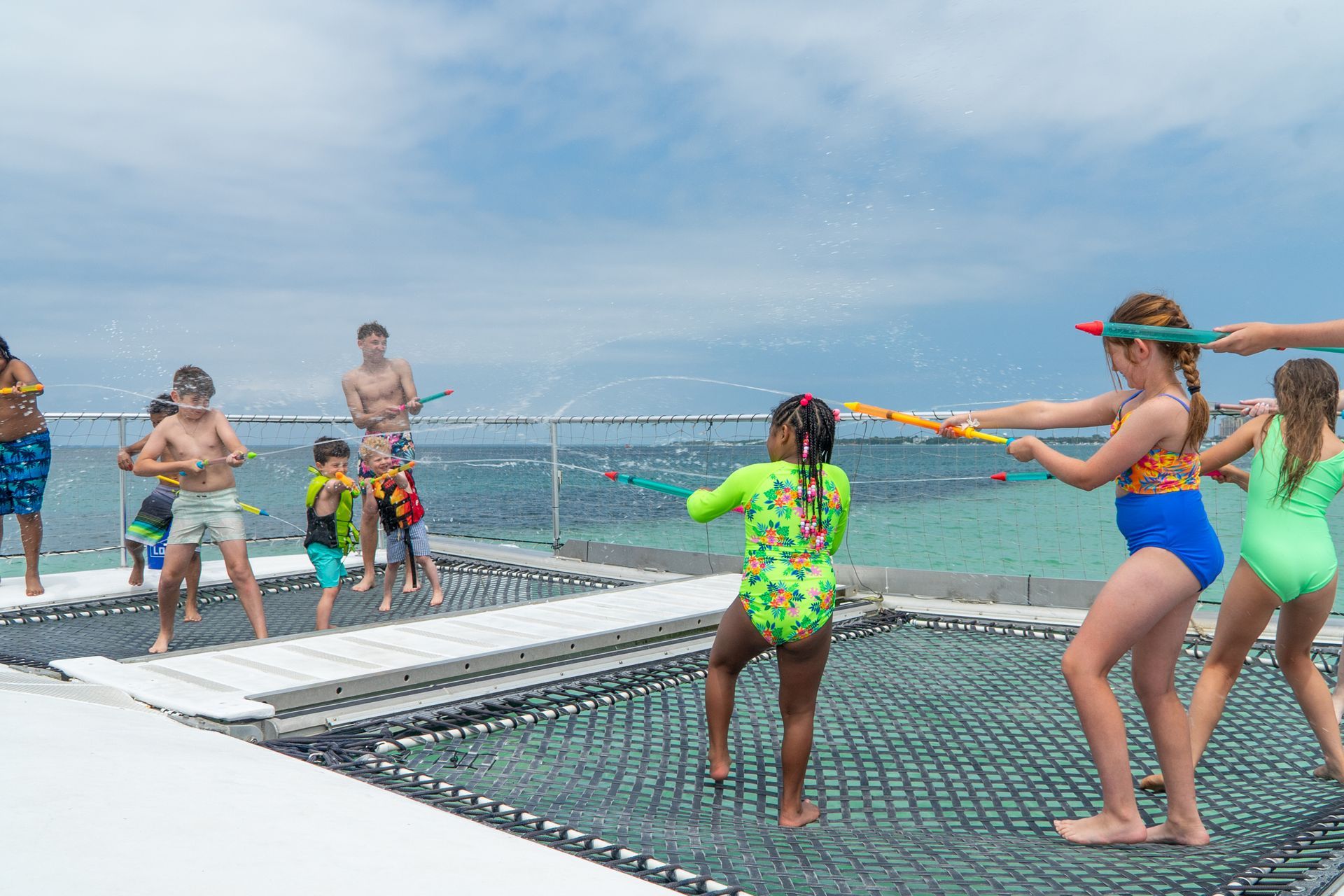 Kids playing on dolphin tour