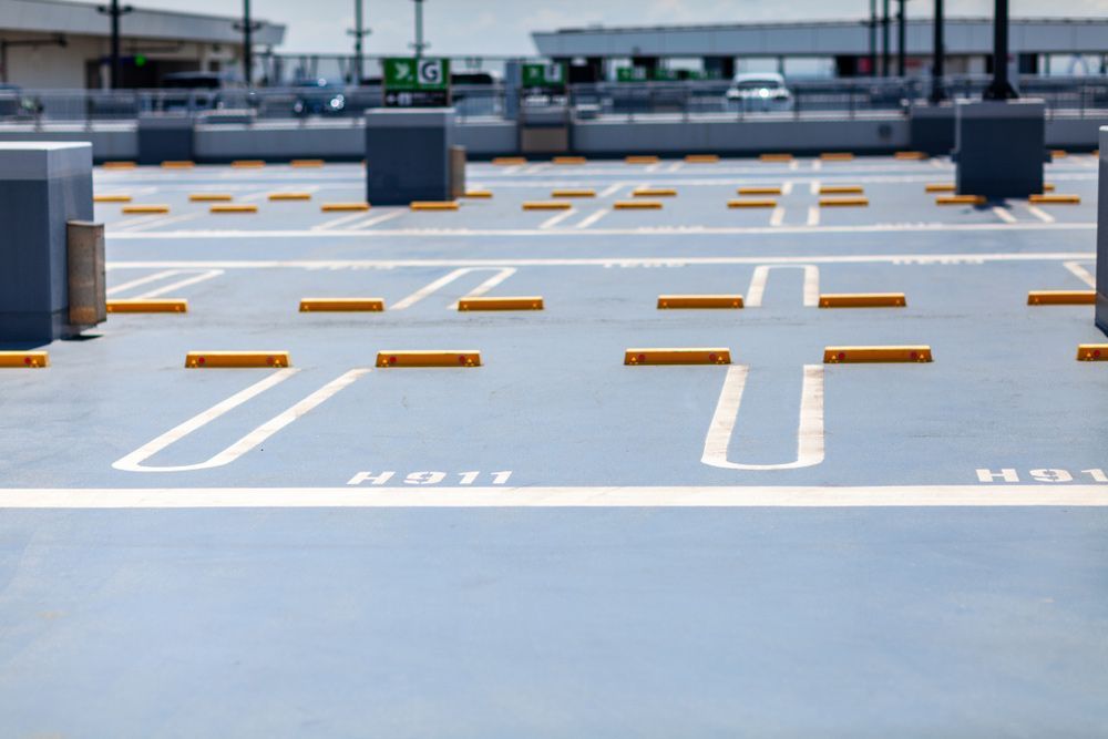 A Parking Garage With Yellow Barriers — Skilled Transport Training And Assessment in Woongarrah, NSW