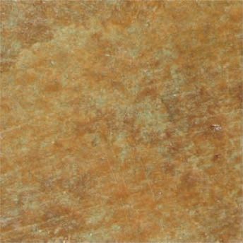 Mottled tan and brown textured surface resembling stone or paper