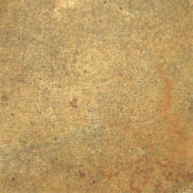 Close-up of a mottled tan and brown textured surface