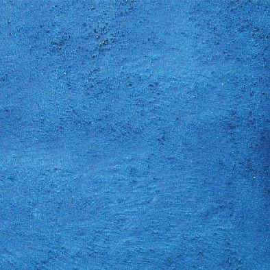 Blue textured painted surface with subtle rough brush marks