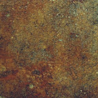 Rusty, mottled brown and green textured surface with speckled discoloration