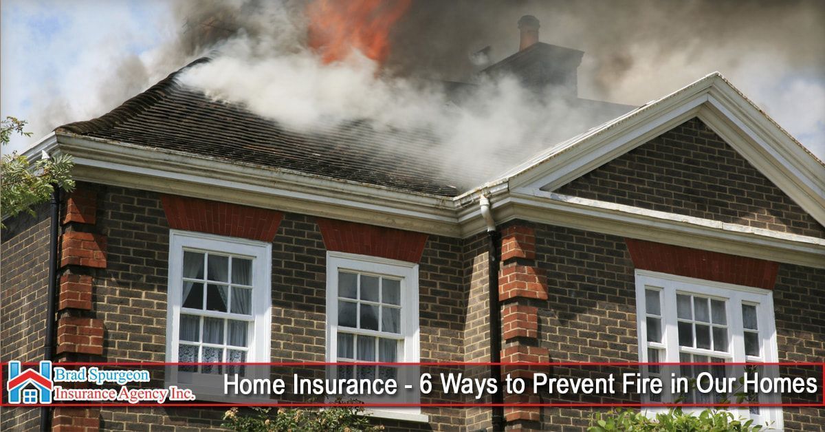 A brick house with smoke billowing from its roof