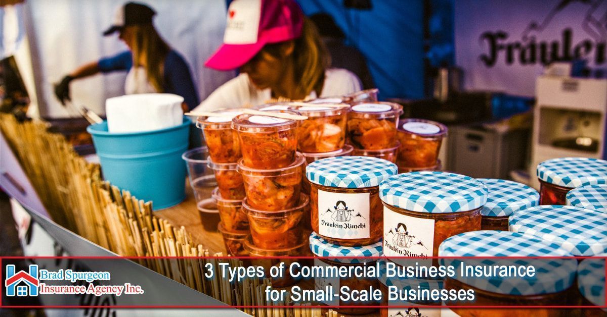 Food stall at an outdoor market with jars of food for sale