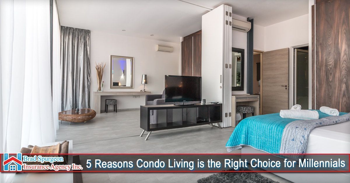 A modern studio apartment with a bed, TV console, and vanity