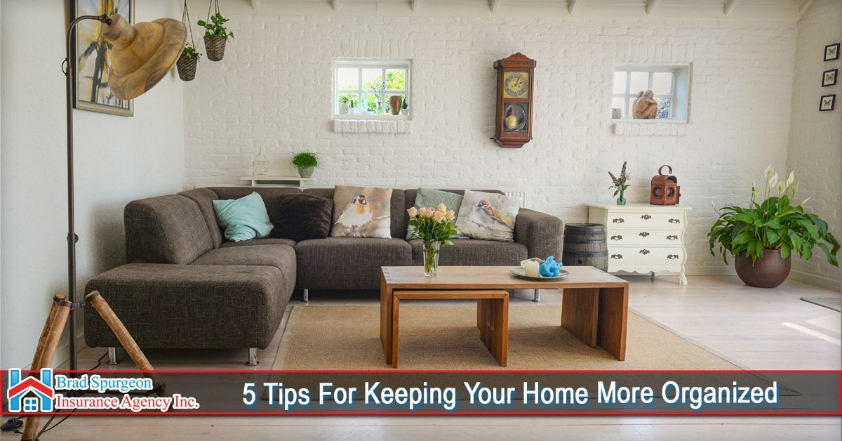 A cozy living room with a brown sectional sofa, wooden coffee table, and plants