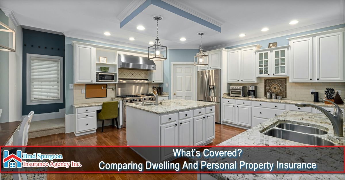 A bright, modern kitchen with white cabinets, granite countertops, and a center island