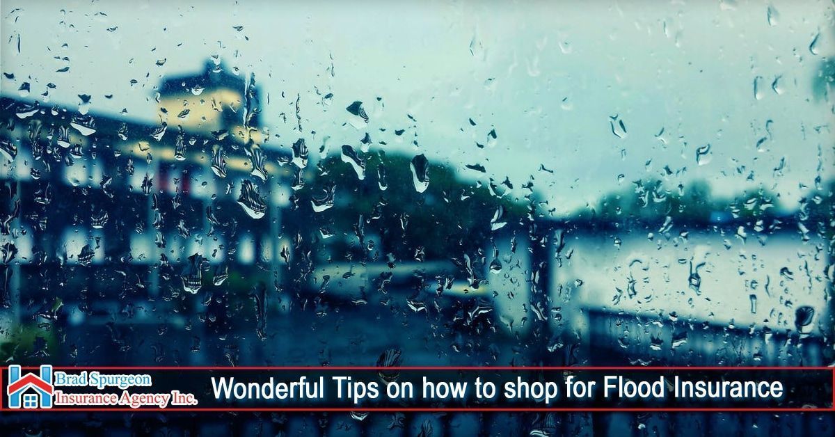 Raindrops on a window pane with a blurred background