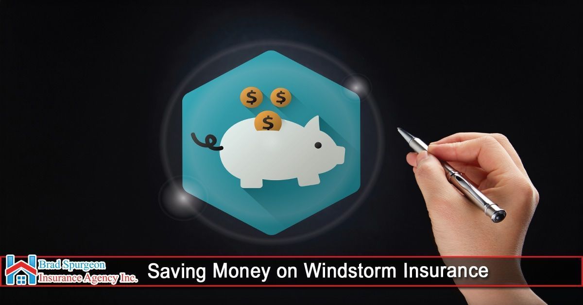 A hand holds a pen near a blue hexagonal icon with a white piggy bank and coins