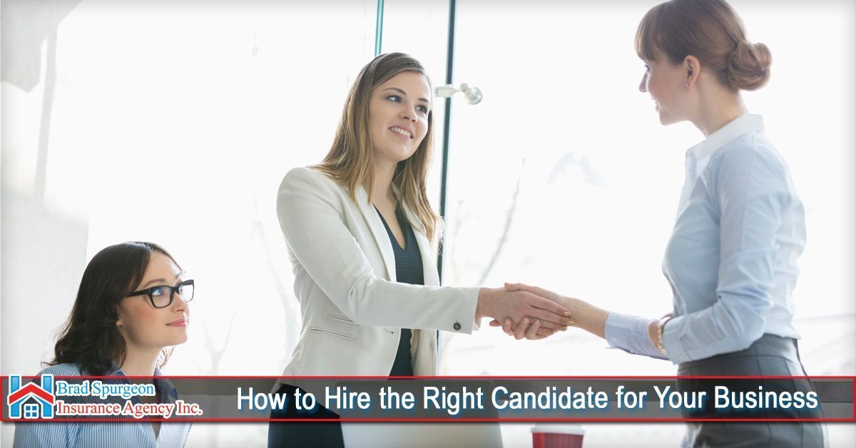 Three professionals shaking hands in an office setting