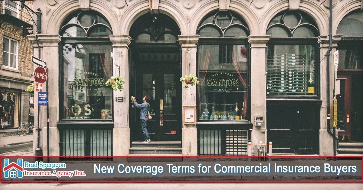 A person approaches a historic building storefront