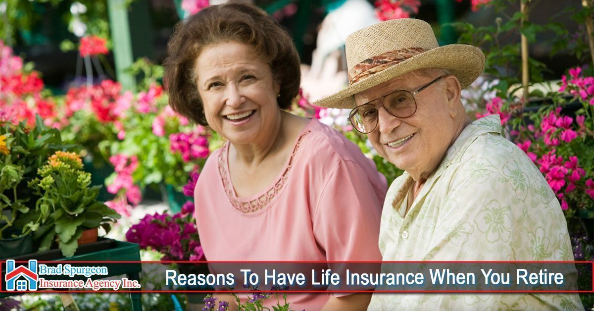 Smiling couple surrounded by flowers in a garden