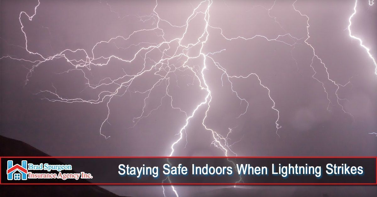 Bright white lightning bolts against a dark sky