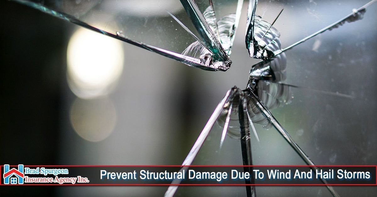 A shattered window pane with cracks radiating from a center point