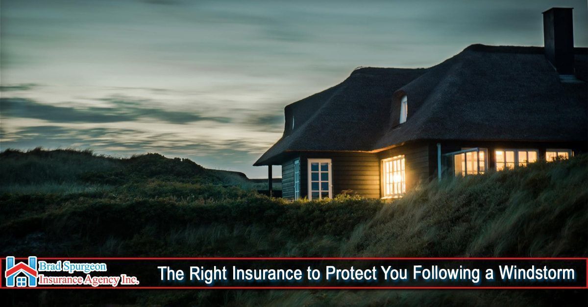 A home at dusk on a grassy hill