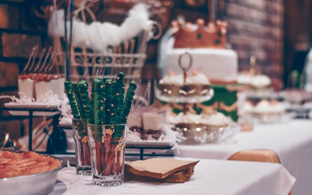 There is a table with a lot of food on it.