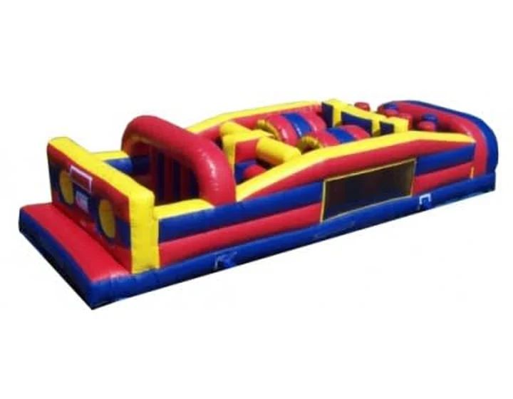 Colorful inflatable obstacle course with red, yellow, and blue barriers on a white background
