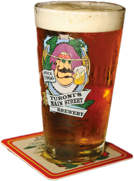A glass of beer from turoni 's main street brewery sits on a coaster