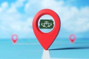A red map pin with a claddagh symbol on it.
