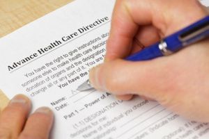 A person is filling out an advance health care directive form