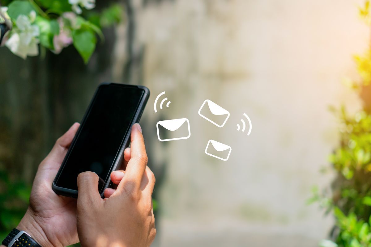 A person is holding a cell phone in their hand.