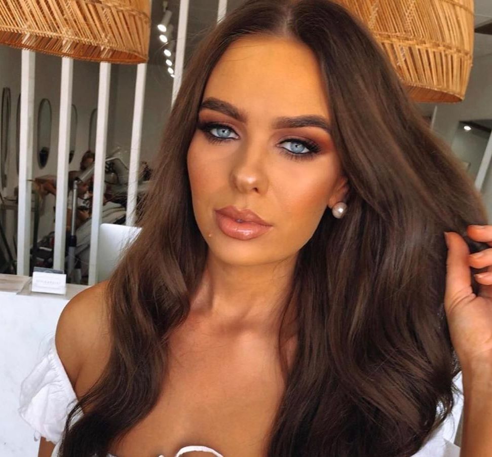 A Woman With Curly Hair Is Getting Her Eyebrows Done — It's All About Brows In Varsity Lakes, QLD
