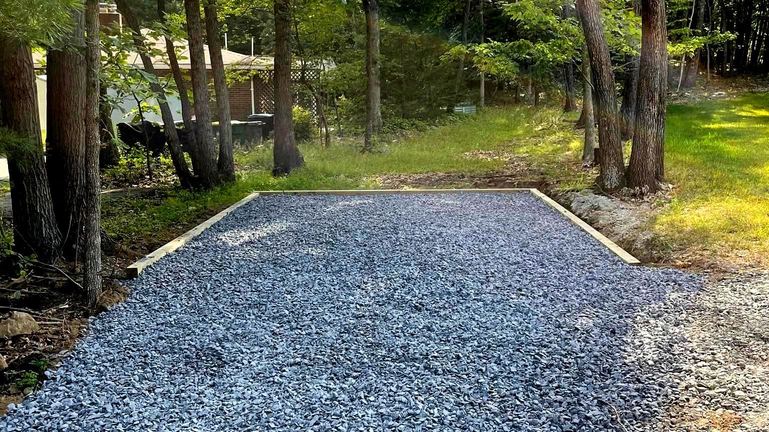 A gravel parking pad by Tailored Excavation.