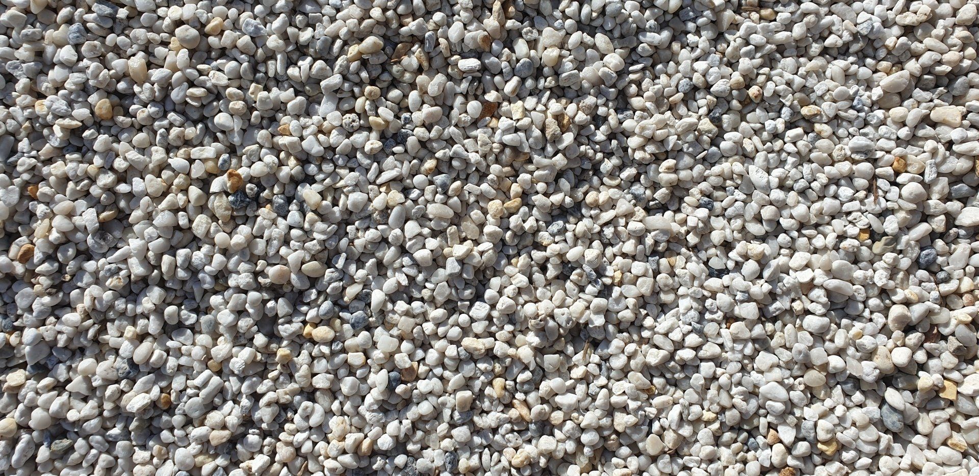 Close-up of small, light-colored gravel stones.