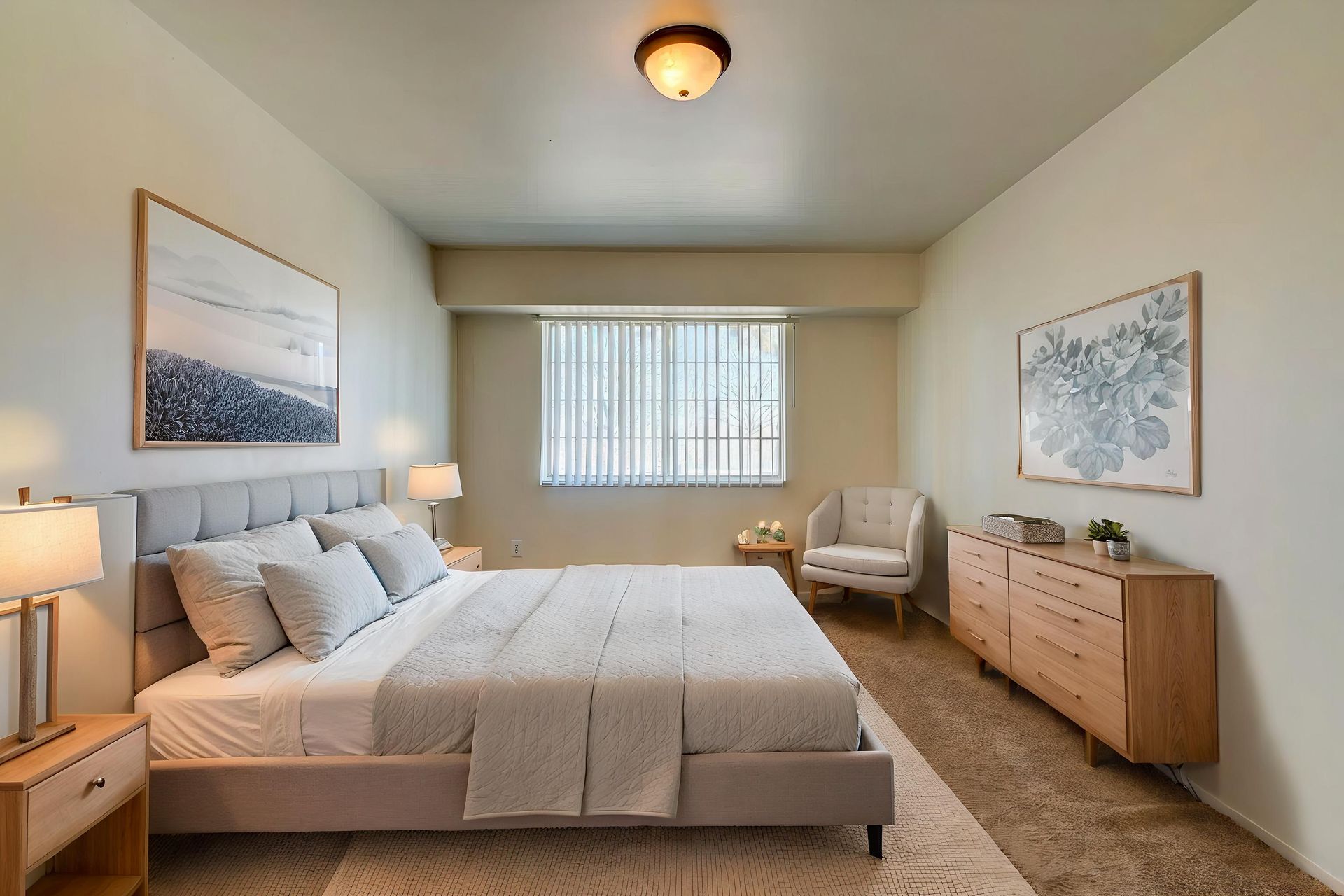 An empty bedroom with a window and a light on the ceiling.