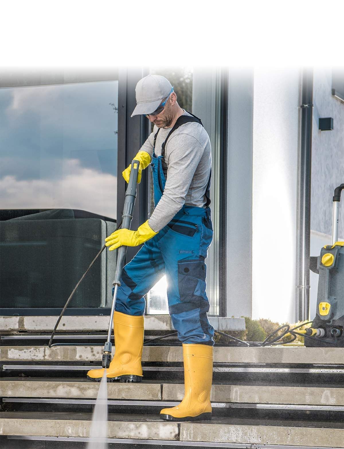 Man Power Washing Stairs