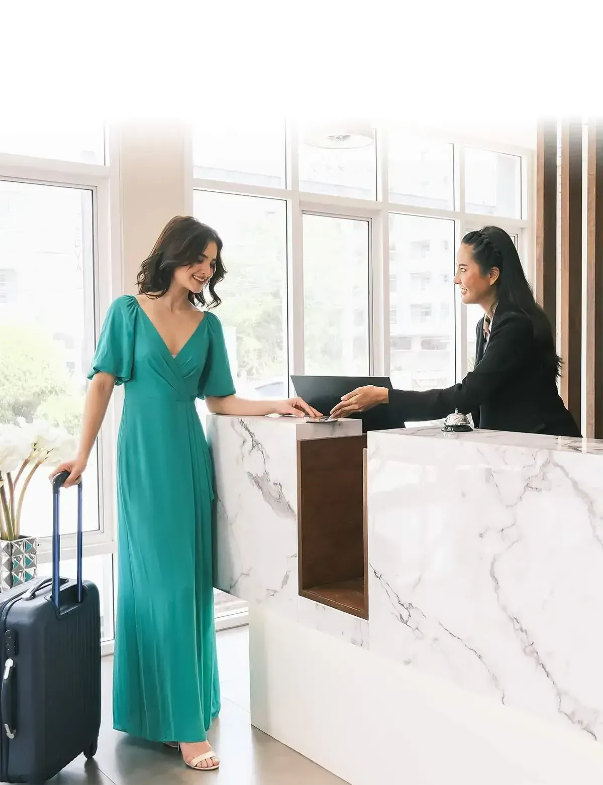 Woman Checking in on a Hotel