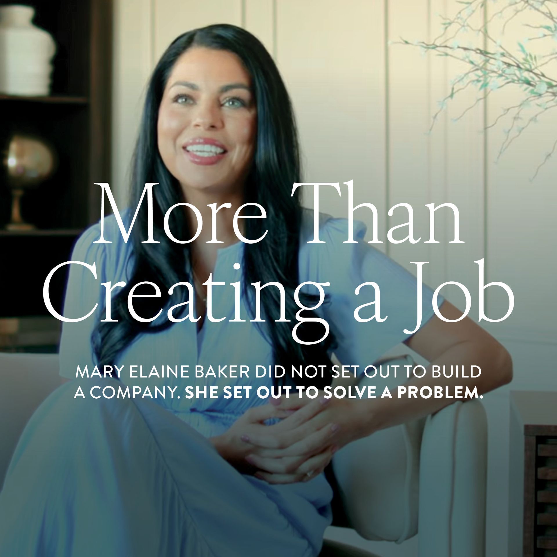 Woman seated on a couch in a bright room, with text: “More Than Creating a Job” and a company founder subtitle