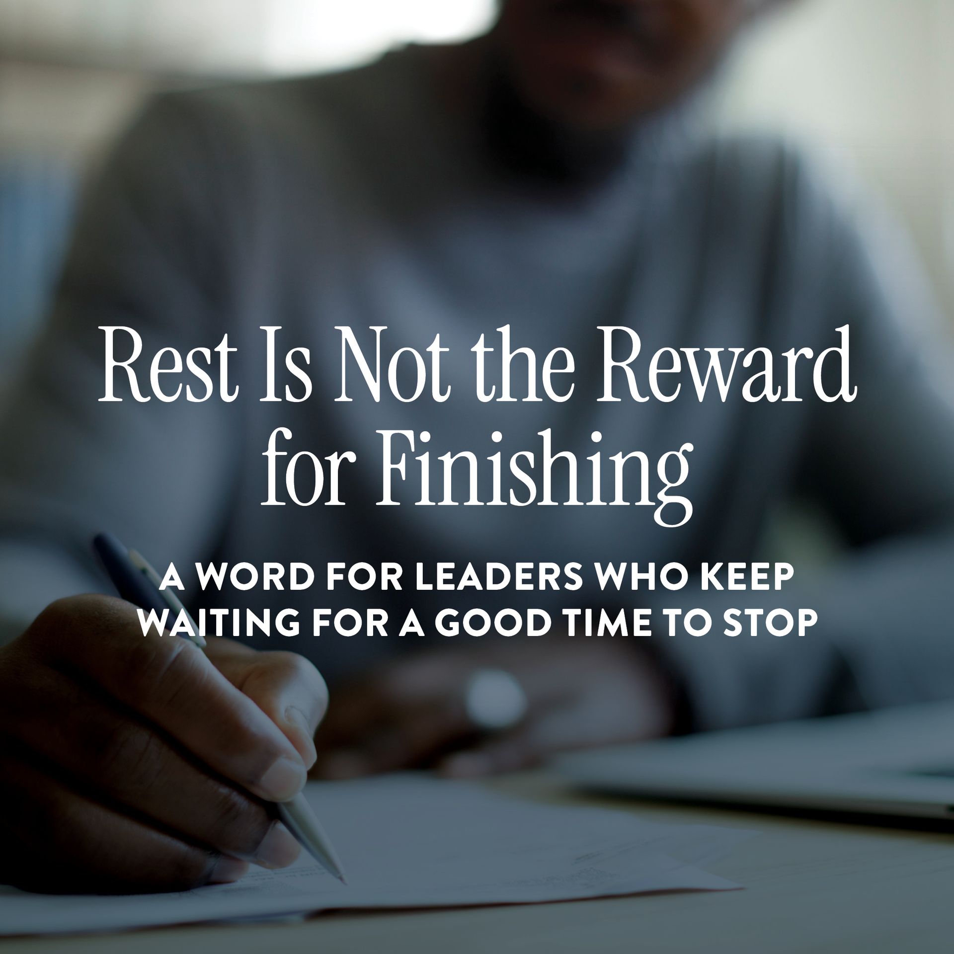Person writing in a notebook with text overlay: “Rest Is Not the Reward for Finishing” and a smaller subtitle.