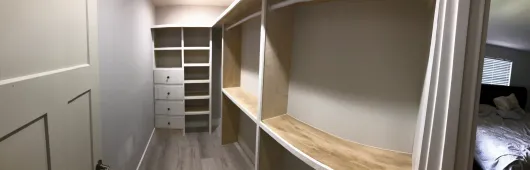 Custom walk-in closet with built-in shelves and drawers