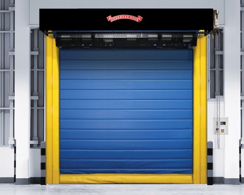 Blue industrial roll-up door with yellow side panels in a warehouse loading bay