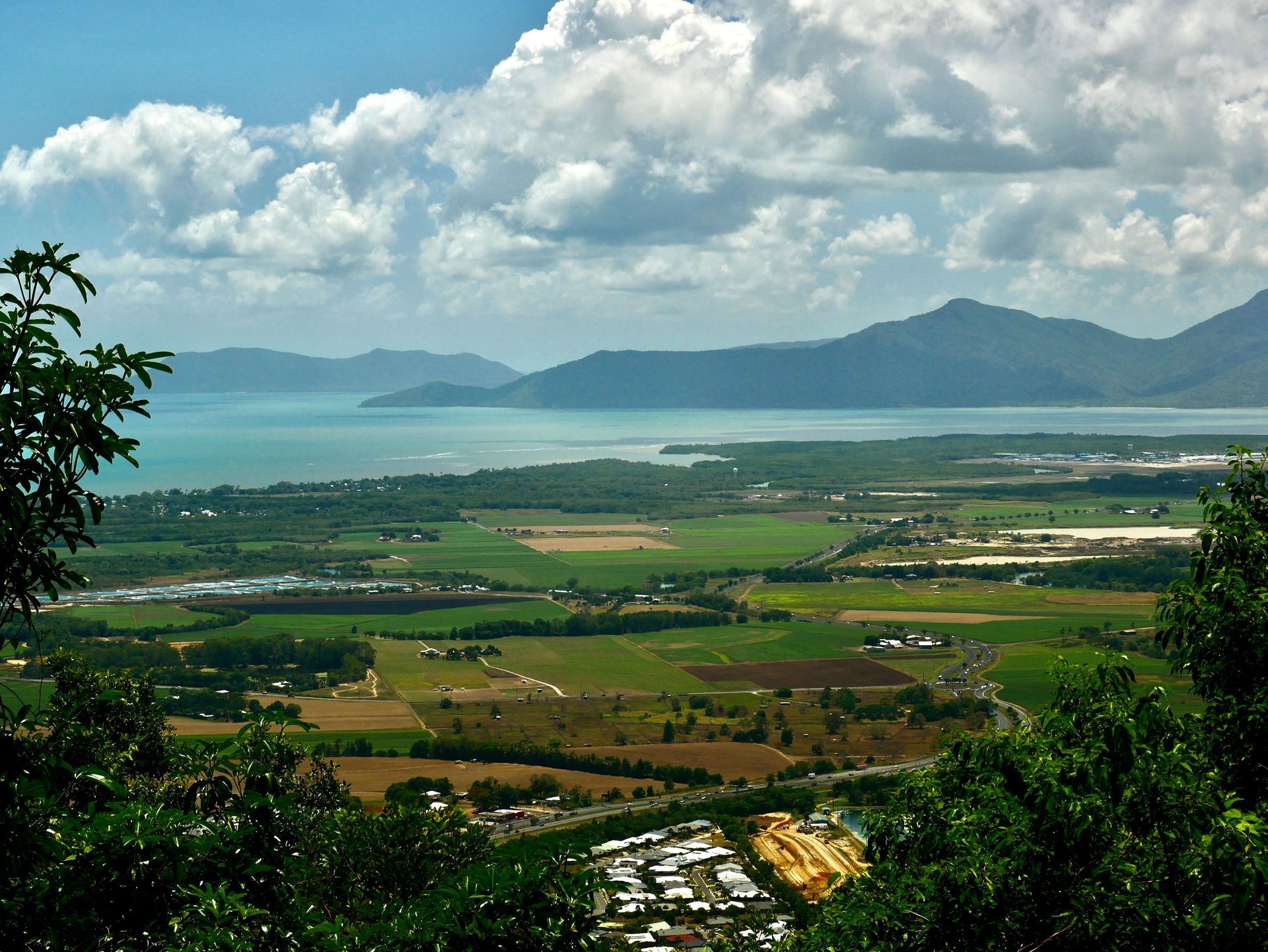 Green Fields Meet The Coast Under A Cloudy Sky — Ace Fridge Door Seals In Atherton Tablelands, QLD