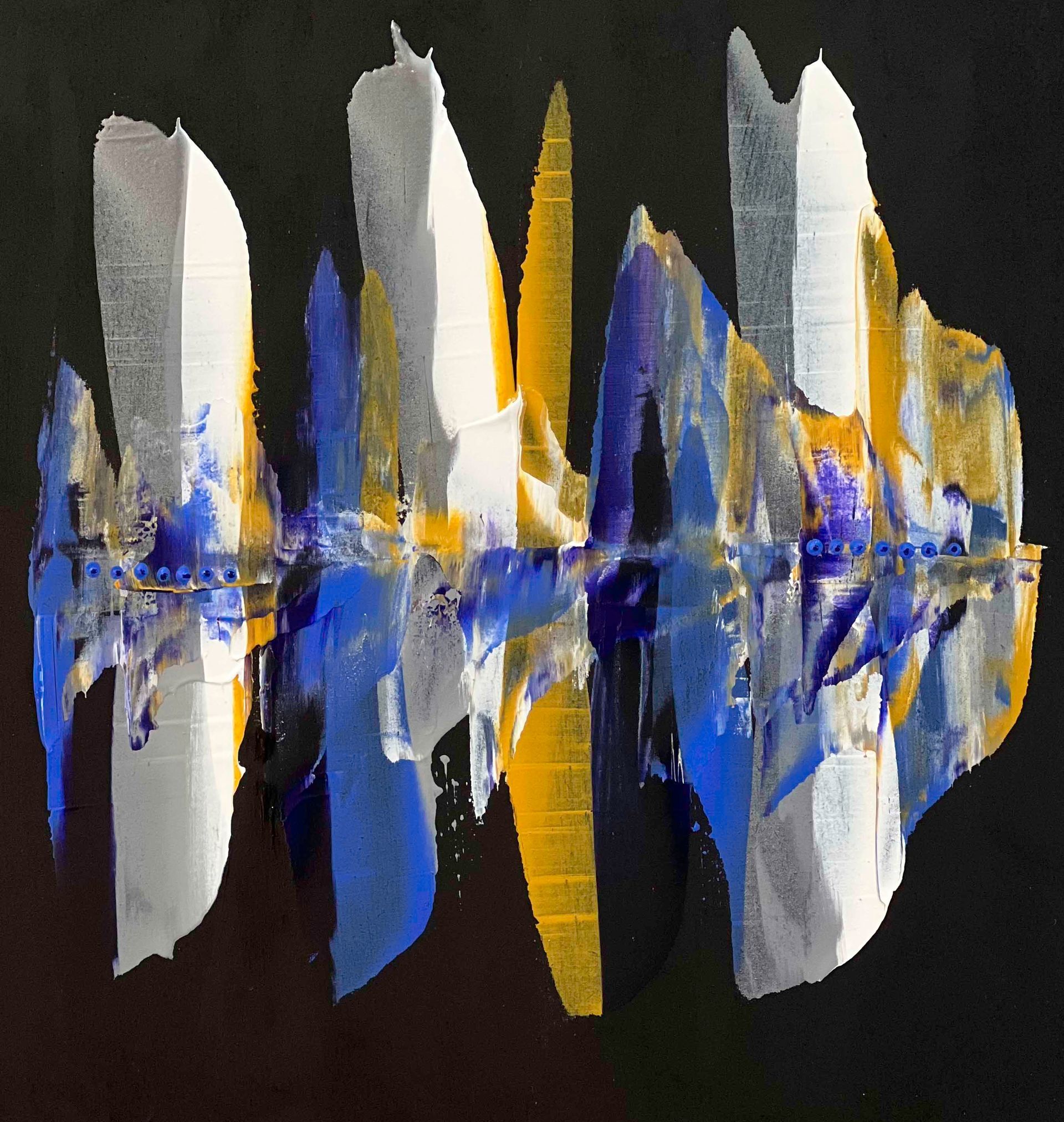 Black mannequin wearing a draped abstract patterned garment with white, blue, and gold accents
