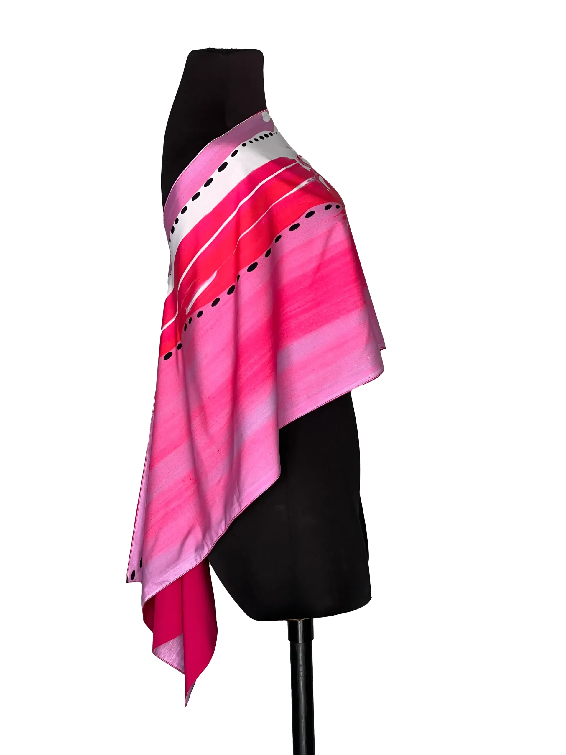 Black mannequin wearing a pink patterned off-shoulder top and black skirt