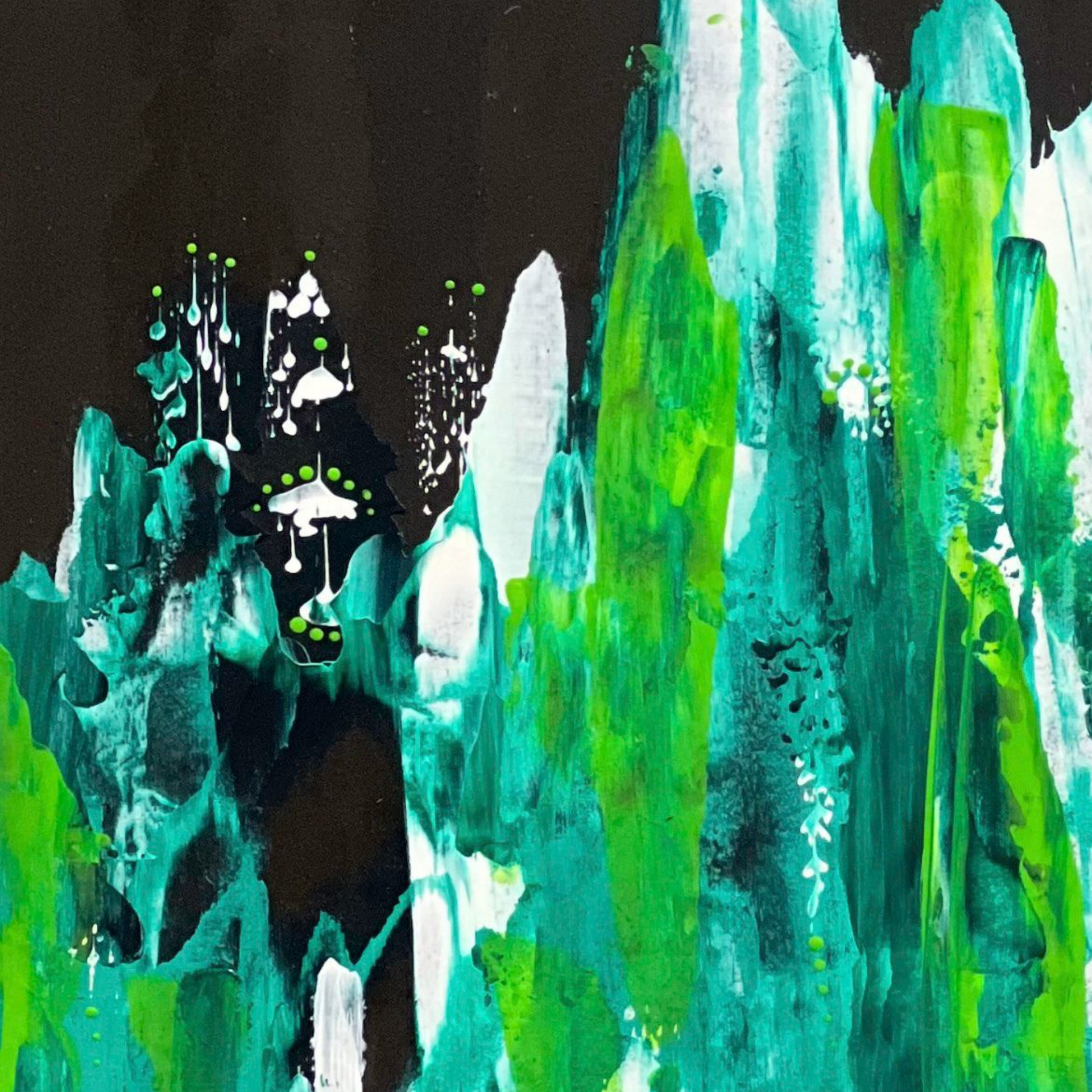 Black dress form with a teal and green abstract scarf draped around the neck.