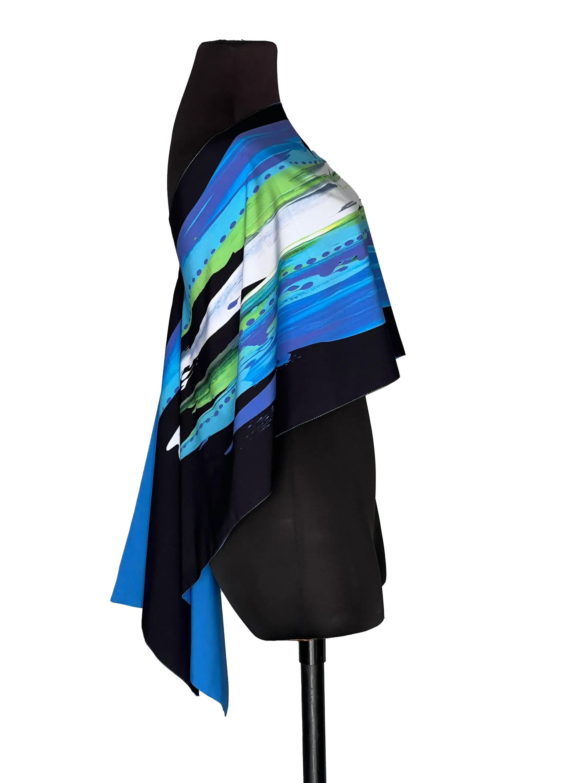 Black mannequin wearing a blue, green, and white striped poncho top