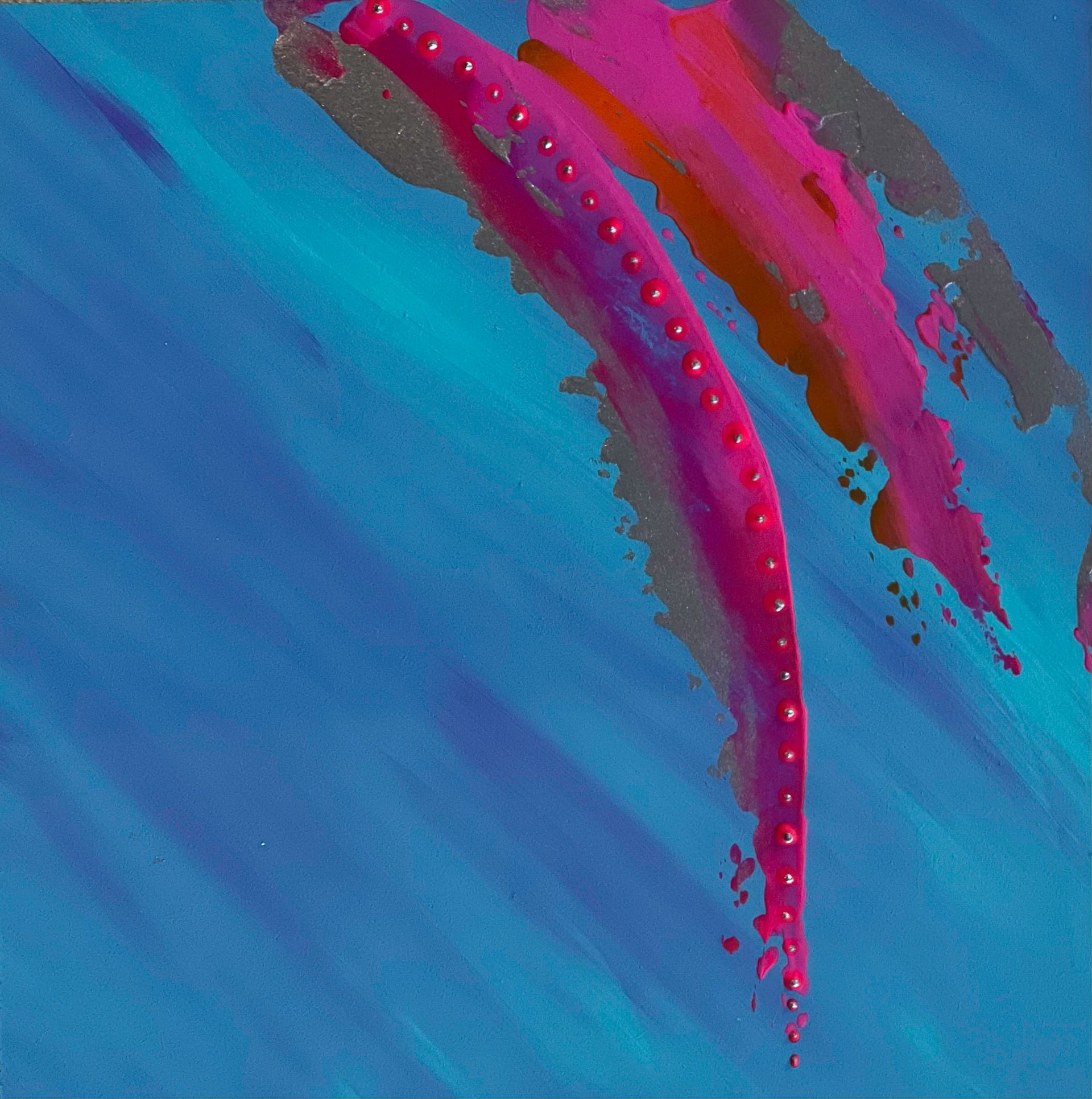 Blue and pink abstract patterned crop top on a black mannequin.